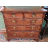 An 18th century walnut chest of two short over three long graduated drawers.