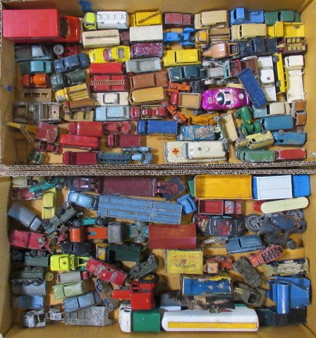 Two boxes containing a large quantity of Lesney Matchbox play worn vehicles.