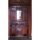 An early 20th century profusely carved oak hallstand.