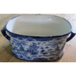 A reproduction blue & white foot bath.