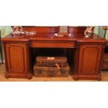 A large Victorian mahogany inverted break-front pedestal sideboard,