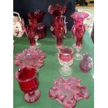 A large collection of cranberry glassware to include: six champagne flutes, sweet dishes,