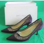 A pair of Jimmy Choo purple lady's shoes size 4.