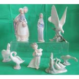 A collection of eight various Lladro and Nao figurines.