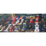 A quantity of die-cast racing cars.