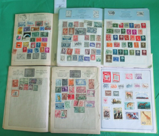 Four albums containing a quantity of all world stamps.