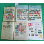 Four albums containing a quantity of all world stamps.