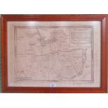 A reproduction maple framed and glazed map of Kettering and environs.