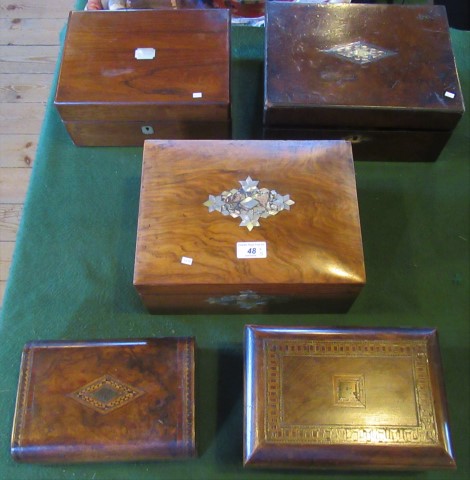 A collection of five miscellaneous mahogany, walnut and rosewood jewellery boxes.