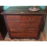 A 19th century oak chest of four long drawers on bun feet.