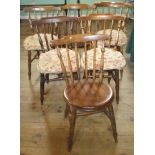 A set of six Hereford-style stick-back dining chairs.