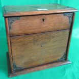 An oak and brass bound stationery box.