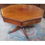 A 19th century octagonal rent table on quadruple base, terminating in brass castors.