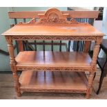 An Edwardian carved oak three tier buffet.