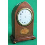 An Edwardian mahogany and shell inlaid mantle clock.