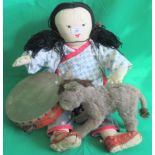 An Oriental felt doll, together with soft toy donkey and a tambourine.