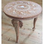 A profusely decorated Indian occasional table.