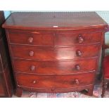 A Victorian mahogany bow front chest of two short over three long graduated drawers lacking back