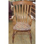 An early 20th century beech and elm Windsor armchair.