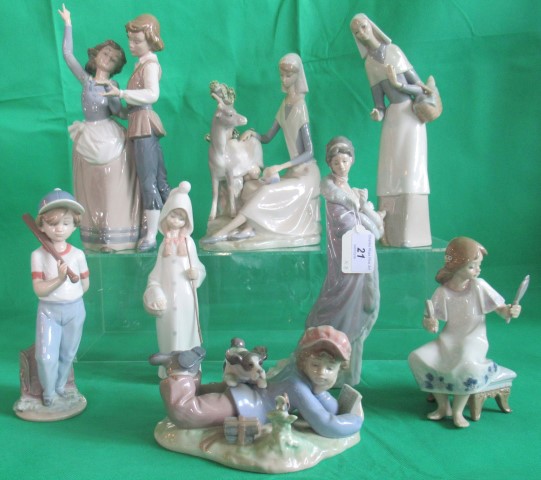 A collection of eight various Lladro figurines, to include: a dancing couple, baseball player,