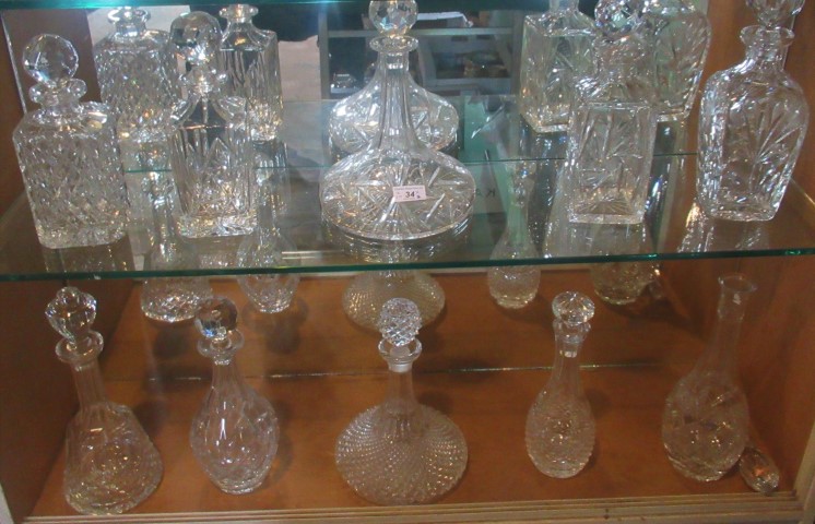 A collection of ten various moulded and cut glass decanters.