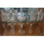 A collection of ten various moulded and cut glass decanters.