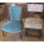 An Edwardian upholstered fireside chair, together with another chair.