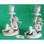 A pair of 19th century Conta & Boehme porcelain figural candlesticks.