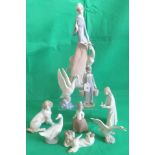 A collection of nine various Lladro and Nao figurines, to include: an angel, three ducks,