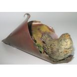 An Austrian cold painted bronze, depicting a small songbird within a folded leaf,