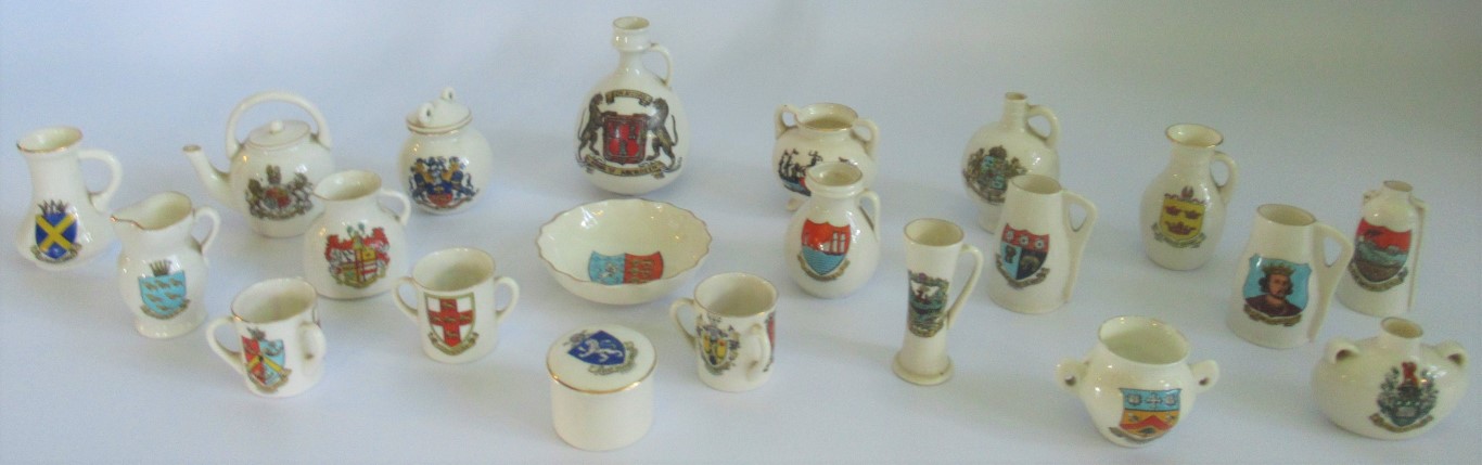 A quantity of miscellaneous Goss crested ware china, to include: loving cups, ewers,