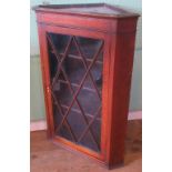 A Victorian oak astragal glazed corner cupboard.