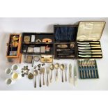 A box containing a quantity of miscellaneous items, to include: silver plated cake forks,