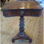 A Victorian rosewood single drawer pedestal table on carved central pedestal and triform base.