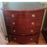 A 20th century small mahogany bow front chest of four long graduated drawers.