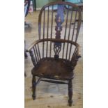 A 19th century oak hooped back Windsor armchair.