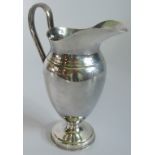 A hallmarked ewer with loop handle, London 1899.