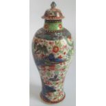 An 18th century Chinese Qainlong porcelain vase and cover, with Dutch clobbered decoration.