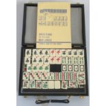 A contemporary Mahjong set in carry case.