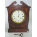 An Edwardian mahogany and inlaid mantle clock.