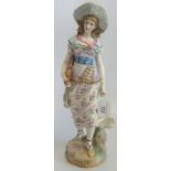 A late 19th century Continental porcelain figure of a lady.