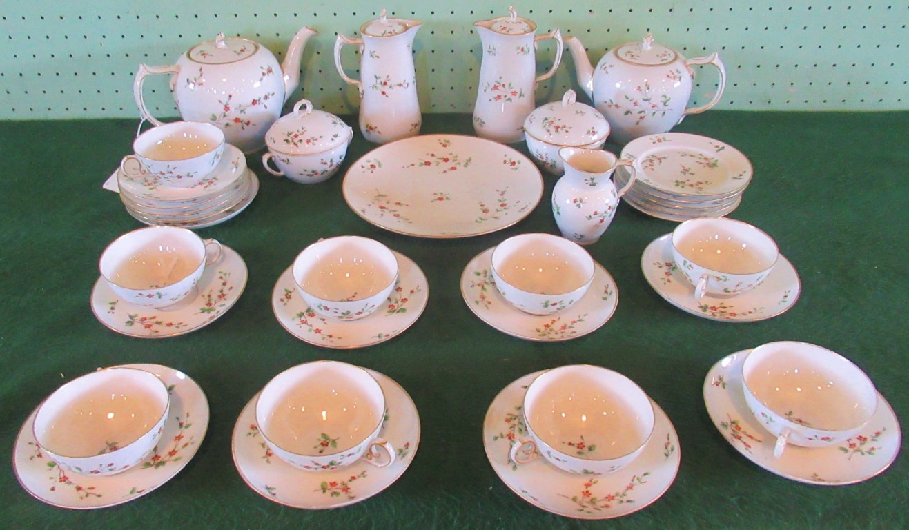 A Royal Copenhagen tea service, with gilt rim and flower decoration,