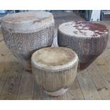 A set of three graduated African drums.