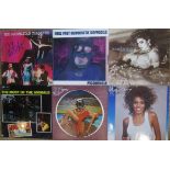 Two boxes containing a large quantity of vinyl LP's, to include: Whitney Houston, Madonna,