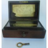 A Victorian miniature six tune musical box.