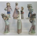 A collection of six various Lladro and Nao figures, to include: flower girls, skier,