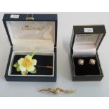 A pair of 9 carat gold and pearl set earrings of floral design,