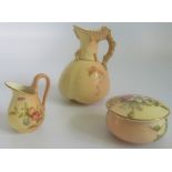 A Royal Worcester blush ivory ewer, together with a small jug and powder pot.