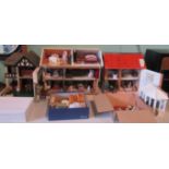 Three various dolls houses, each one fully furnished,