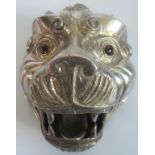 A white metal lions head.